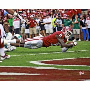 CeeDee Lamb Oklahoma Sooners Unsigned Crimson Jersey Diving For Touchdown Photograph