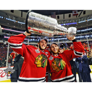 Patrick Kane & Jonathan Toews Chicago Blackhawks Unsigned 2015 Stanley Cup Champions Raising Cup Photograph